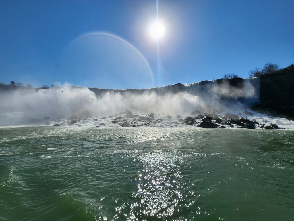  A view of the American side of Niagara Falls from a boat. Most of the falls are obscured by mist. 