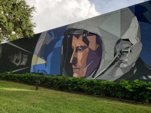 A mural of an astronaut on the side of a building.